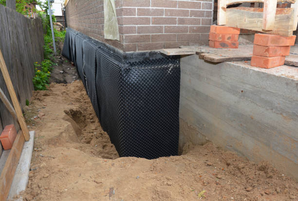 SJ Waterproofing Pros technician performing targeted Sump Pump Installation assessment in Wyandotte, MI